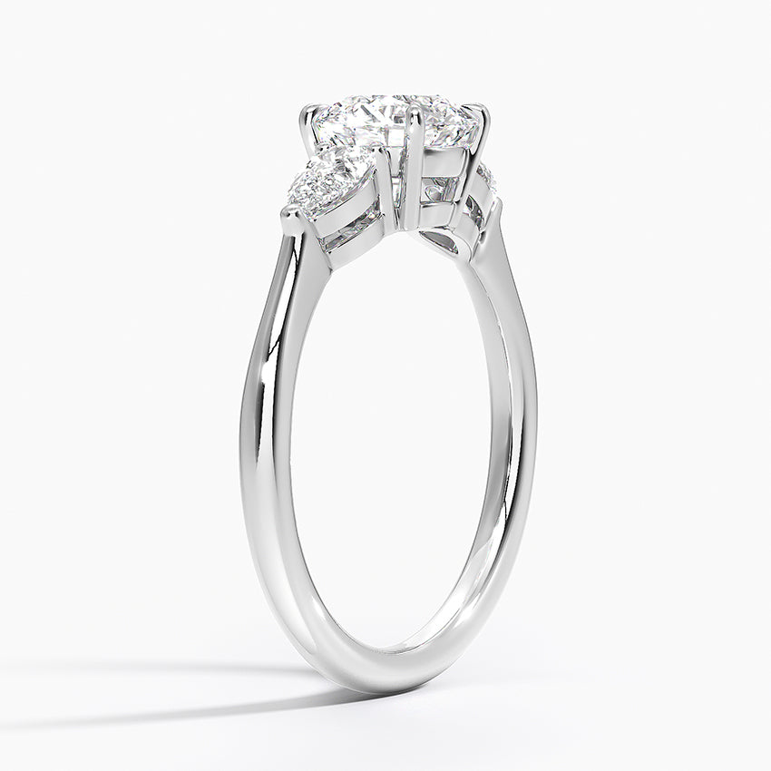 Round Cut Three-Stone Engagement Ring with Pear Side Accents in Solid Gold⁠