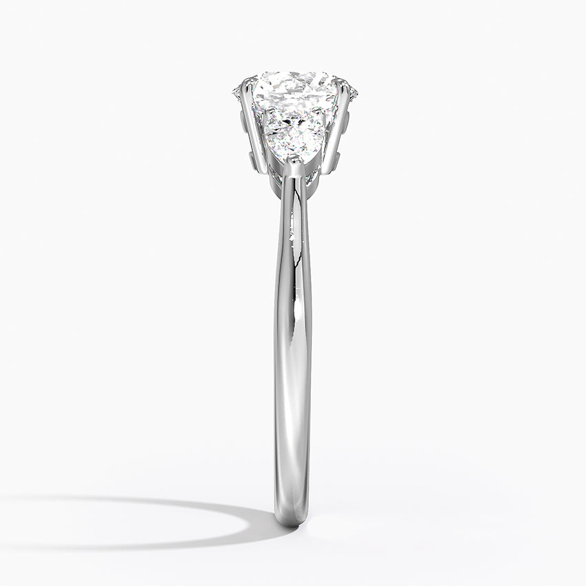 Round Cut Three-Stone Engagement Ring with Pear Side Accents in Solid Gold⁠