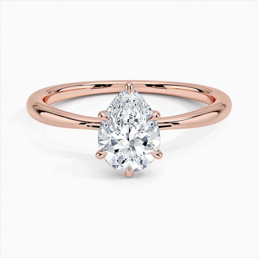 Pear Cut Solitaire Engagement Ring in Solid Gold⁠