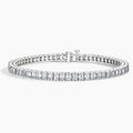 White gold tennis bracelet with emerald-cut lab-grown diamonds on a white background