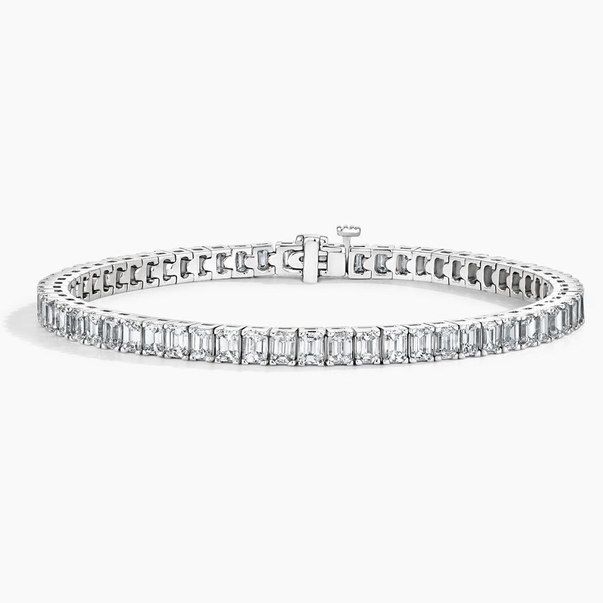 White gold tennis bracelet with emerald-cut lab-grown diamonds on a white background