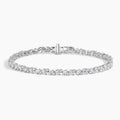 White gold tennis bracelet with fancy-cut lab-grown diamonds on a white background