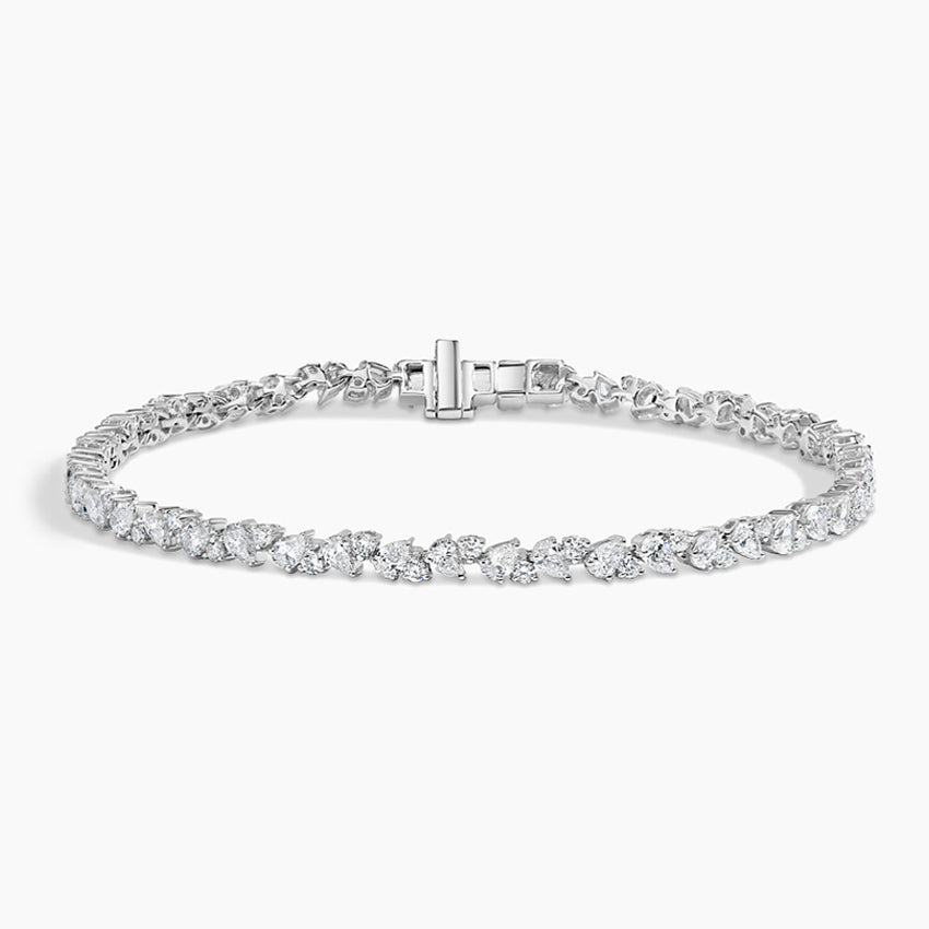 White gold tennis bracelet with fancy-cut lab-grown diamonds on a white background