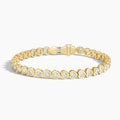 Yellow gold tennis bracelet with heart-shaped lab-grown diamonds, elegant jewelry