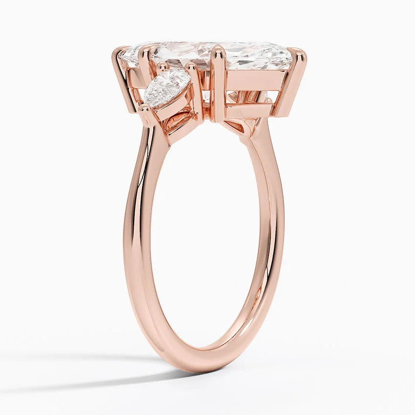 Marquise Cut Three-Stone Diamond Engagement Ring with Pear Sides in Solid Gold⁠
