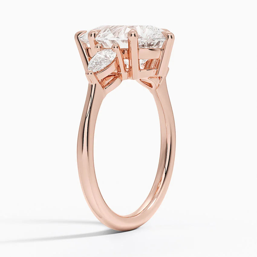 Pear Cut Three-Stone Engagement Ring in Solid Gold⁠